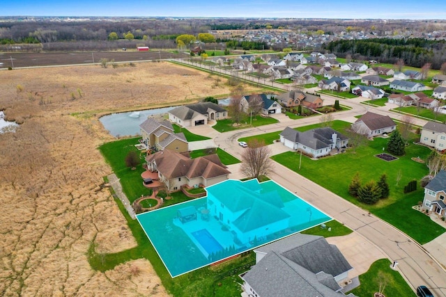 bird's eye view with a water view and a residential view