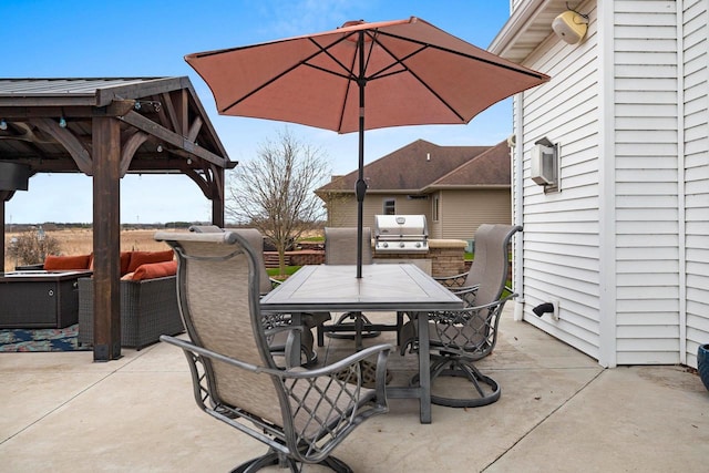 view of patio with outdoor dining area and a grill