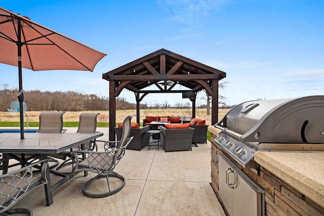 view of patio with grilling area, outdoor dining area, a gazebo, an outdoor kitchen, and outdoor lounge area
