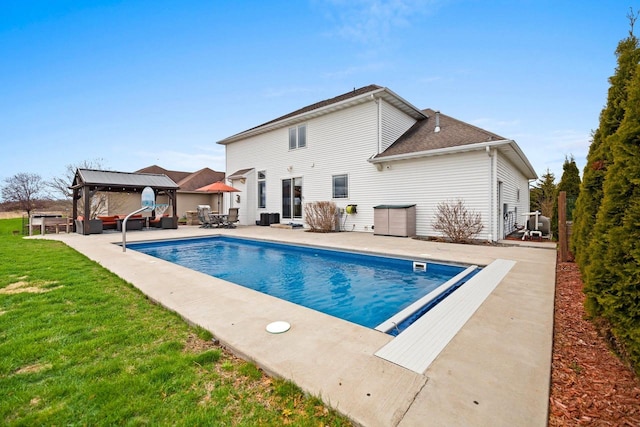pool with a lawn, a patio, a gazebo, and outdoor lounge area