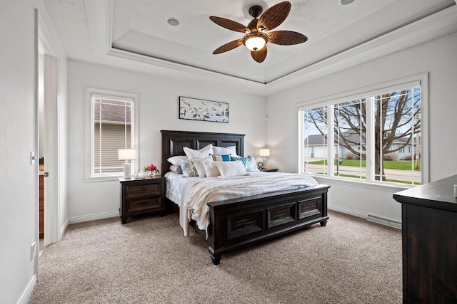 bedroom featuring light colored carpet, a ceiling fan, a raised ceiling, and baseboards