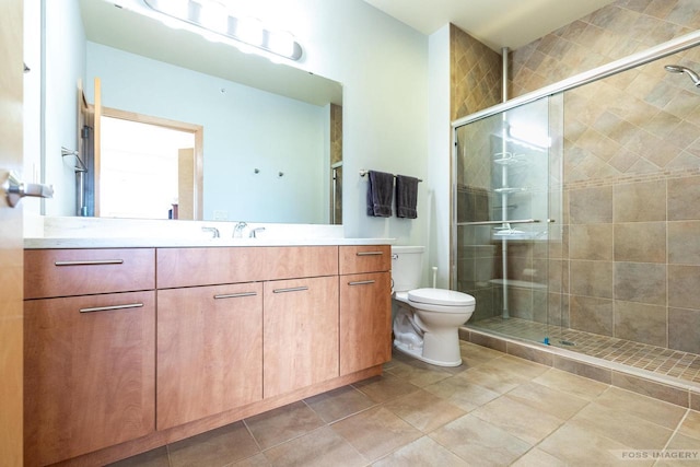 full bathroom with vanity, toilet, tile patterned flooring, and a stall shower