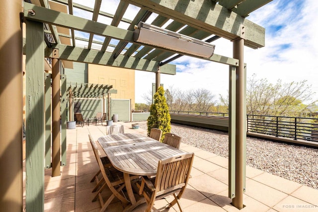 view of patio with outdoor dining area, fence, and a pergola