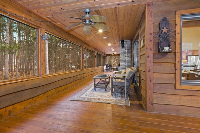 W5929 Driftwood Ln, New Lisbon, WI 53950 - sunroom / solarium featuring wood walls, wooden ceiling, and wood-type flooring