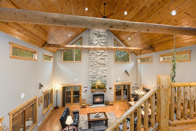 W5929 Driftwood Ln, New Lisbon, WI 53950 - living room with a fireplace, a wood ceiling with exposed beams, wood finished floors, high vaulted ceiling, and recessed lighting