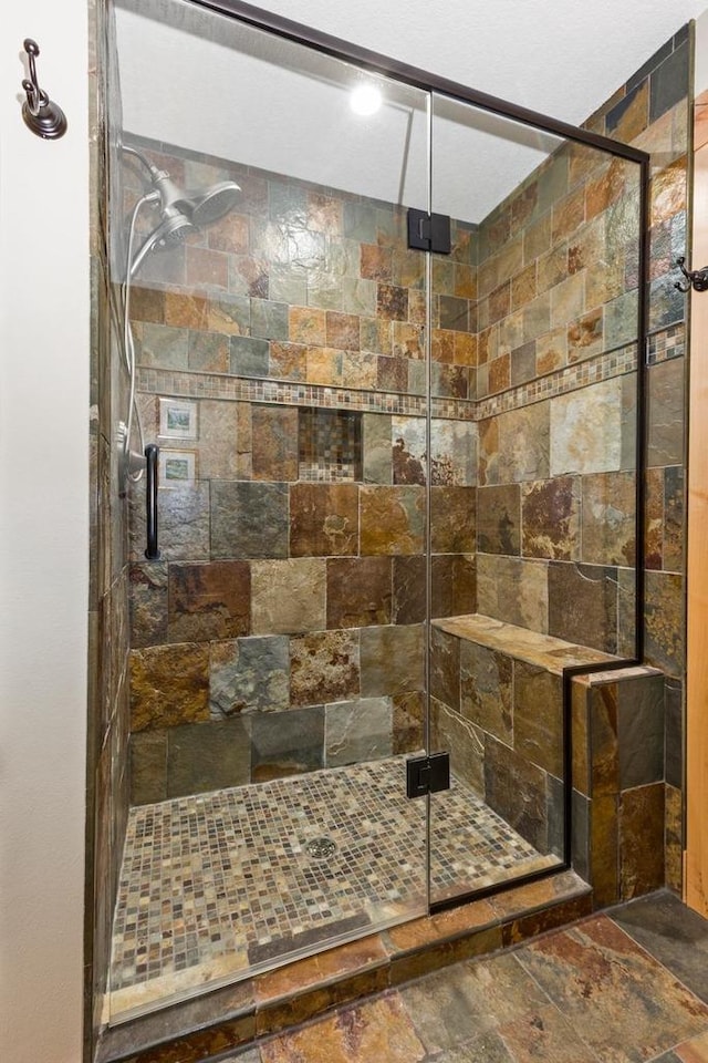 W5929 Driftwood Ln, New Lisbon, WI 53950 - full bath featuring a shower stall and stone finish flooring