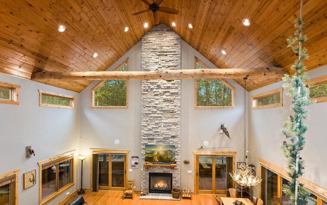 W5929 Driftwood Ln, New Lisbon, WI 53950 - living room featuring a fireplace, high vaulted ceiling, wooden ceiling, ceiling fan, and wood finished floors