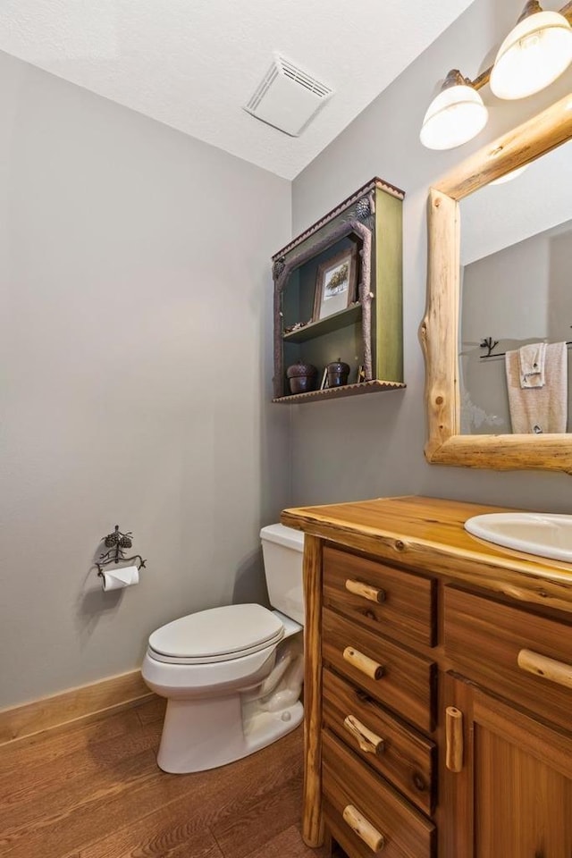 W5929 Driftwood Ln, New Lisbon, WI 53950 - half bathroom featuring vanity and wood finished floors