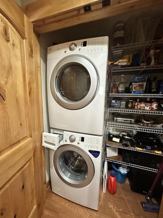 W5929 Driftwood Ln, New Lisbon, WI 53950 - laundry room featuring stacked washing machine and dryer