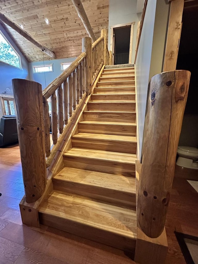W5929 Driftwood Ln, New Lisbon, WI 53950 - staircase with high vaulted ceiling, wooden ceiling, and wood finished floors