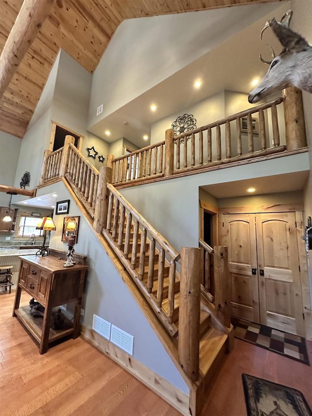 W5929 Driftwood Ln, New Lisbon, WI 53950 - stairs featuring high vaulted ceiling, wood ceiling, wood finished floors, and recessed lighting