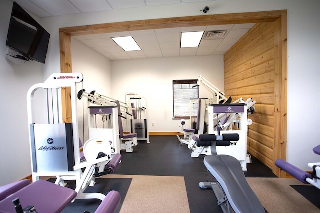 W5929 Driftwood Ln, New Lisbon, WI 53950 - gym featuring a drop ceiling and baseboards
