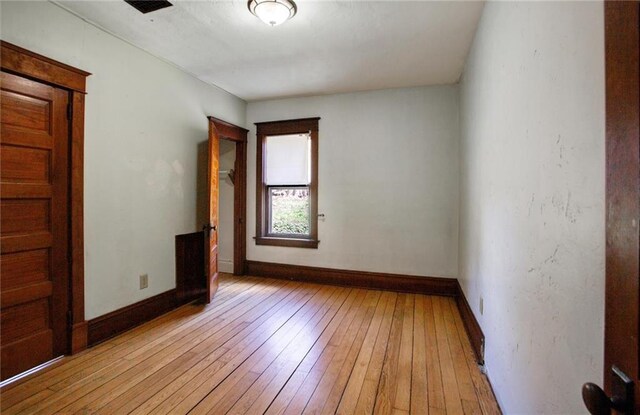 1725 Meadow Hill Dr, Menomonie, WI 54751 - spare room with baseboards and light wood-type flooring
