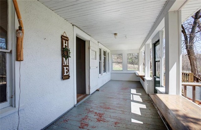 1725 Meadow Hill Dr, Menomonie, WI 54751 - unfurnished sunroom featuring a textured wall and wood finished floors