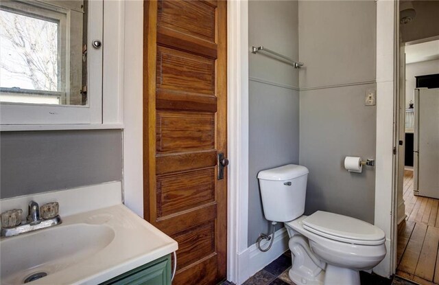 1725 Meadow Hill Dr, Menomonie, WI 54751 - bathroom with baseboards, vanity, and toilet
