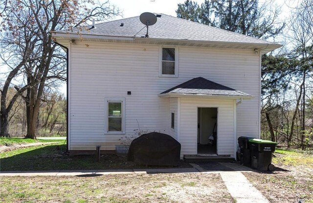 1725 Meadow Hill Dr, Menomonie, WI 54751 - back of property featuring roof with shingles