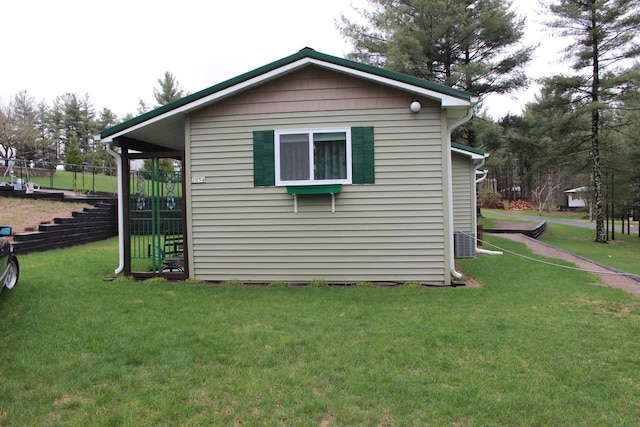 view of property exterior featuring a lawn