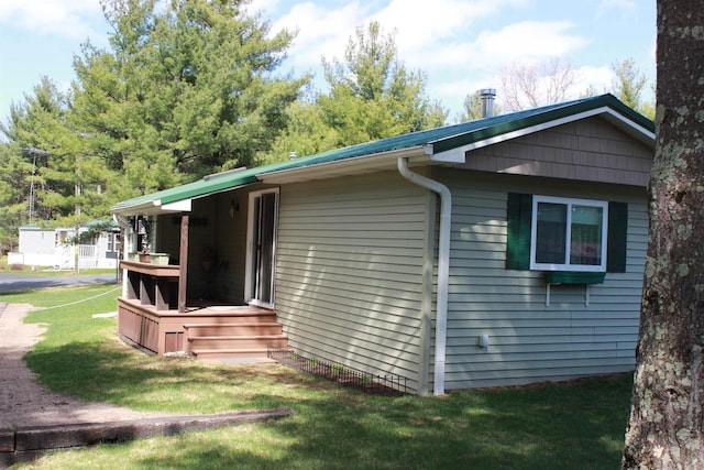 view of property exterior featuring a yard