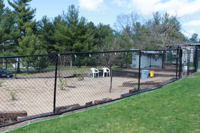 view of home's community featuring a lawn and fence