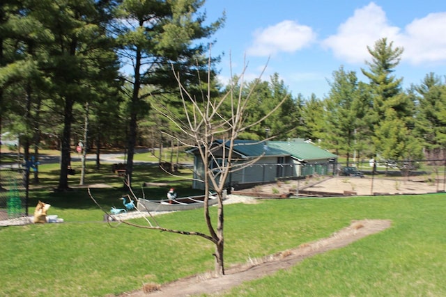 surrounding community featuring a lawn and fence