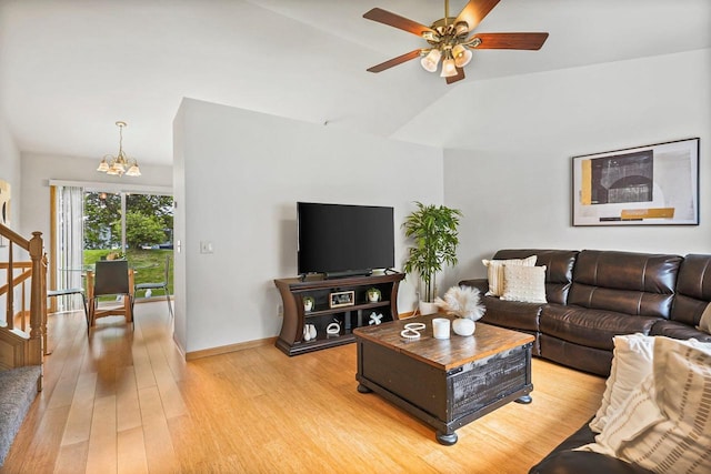 3631 Flagstone Cir, Middleton, WI 53562 - living room featuring vaulted ceiling, a chandelier, ceiling fan, light wood-style flooring, and baseboards