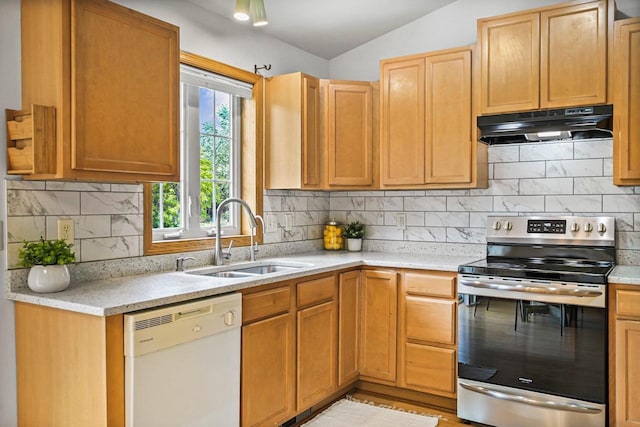 3631 Flagstone Cir, Middleton, WI 53562 - kitchen with white dishwasher, under cabinet range hood, stainless steel range with electric stovetop, a sink, and light countertops