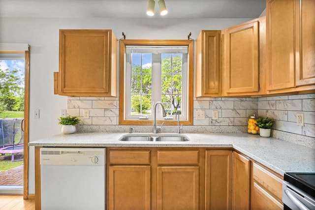 3631 Flagstone Cir, Middleton, WI 53562 - kitchen featuring dishwasher, a sink, tasteful backsplash, and light stone counters
