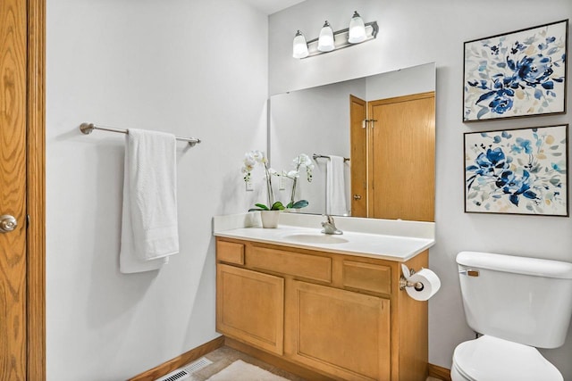 3631 Flagstone Cir, Middleton, WI 53562 - bathroom with vanity, toilet, and baseboards