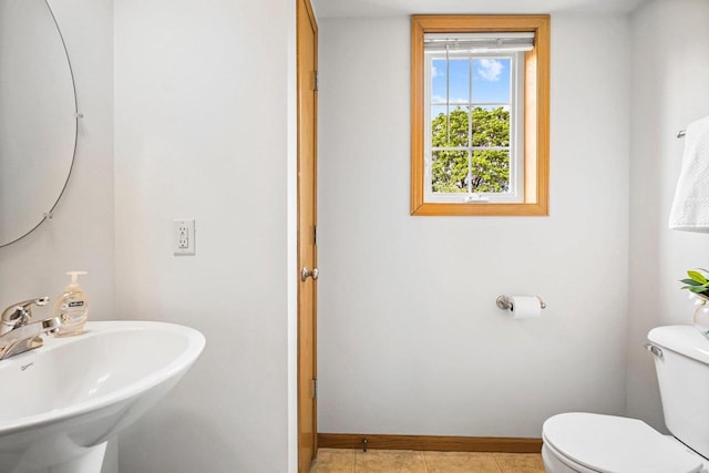 3631 Flagstone Cir, Middleton, WI 53562 - bathroom featuring a sink, toilet, baseboards, and tile patterned flooring