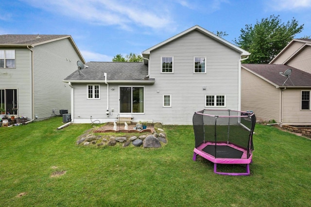 3631 Flagstone Cir, Middleton, WI 53562 - rear view of house featuring a trampoline, a yard, and a patio