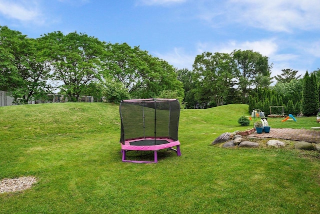 3631 Flagstone Cir, Middleton, WI 53562 - view of grassy yard with a trampoline