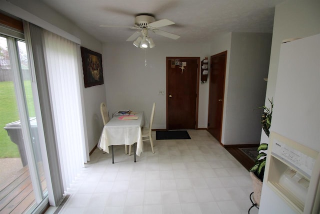 dining area featuring visible vents, a ceiling fan, and light floors