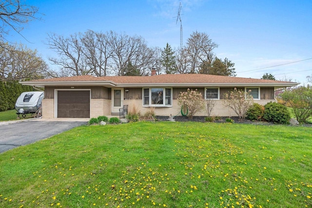 single story home with an attached garage, a front lawn, aphalt driveway, and brick siding