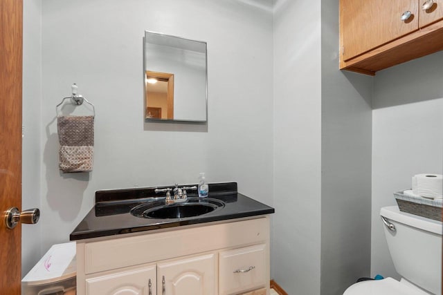 half bath with vanity and toilet