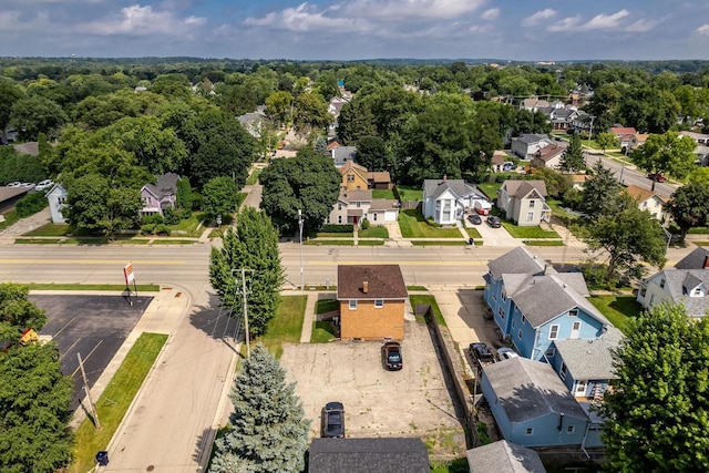 birds eye view of property with a residential view