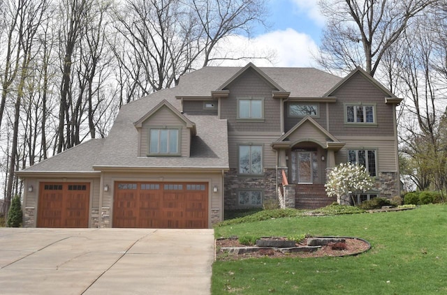 765 Safer Ct, Brookfield, WI 53045 - craftsman-style house with stone siding, a garage, concrete driveway, a front lawn, and roof with shingles