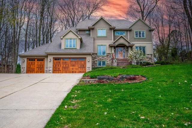 765 Safer Ct, Brookfield, WI 53045 - craftsman-style house featuring a yard, concrete driveway, and stone siding