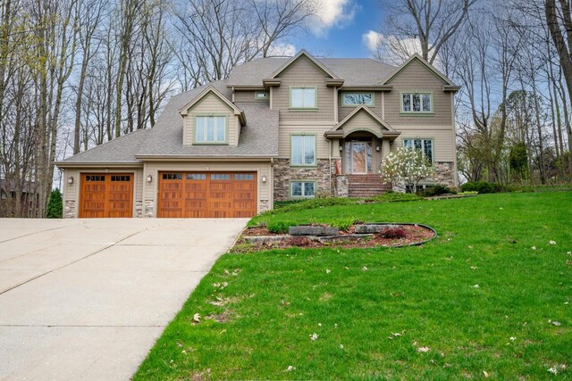 765 Safer Ct, Brookfield, WI 53045 - craftsman-style home featuring concrete driveway, an attached garage, a front lawn, and stone siding