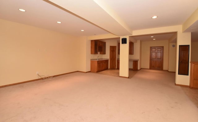 765 Safer Ct, Brookfield, WI 53045 - unfurnished living room featuring light carpet, indoor wet bar, baseboards, and recessed lighting
