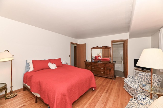 bedroom with wood finished floors