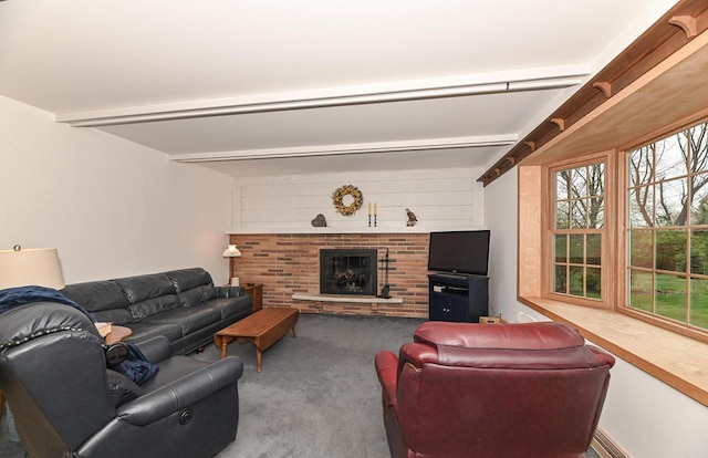 carpeted living area with beam ceiling and a fireplace
