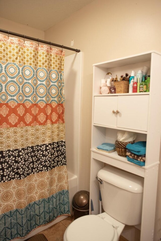2193 Julie Ave, Sparta, WI 54656 - bathroom featuring tile patterned floors, toilet, and a shower with shower curtain