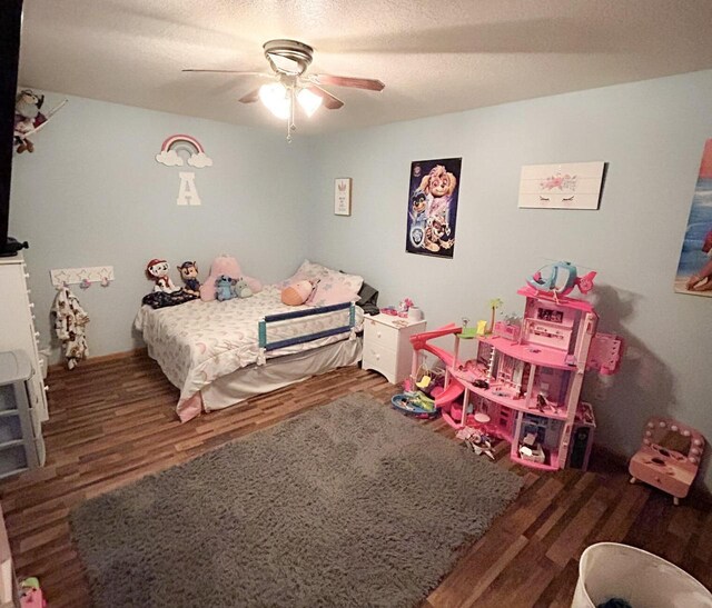2193 Julie Ave, Sparta, WI 54656 - bedroom featuring a textured ceiling, ceiling fan, and wood finished floors