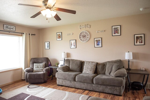 2193 Julie Ave, Sparta, WI 54656 - living room featuring a ceiling fan, a textured ceiling, and wood finished floors