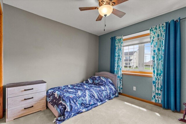 bedroom featuring carpet flooring, baseboards, and ceiling fan