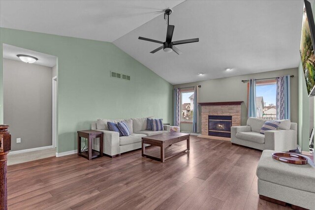 living room with visible vents, plenty of natural light, vaulted ceiling, and ceiling fan