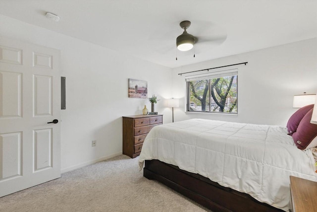 bedroom with baseboards, carpet flooring, and a ceiling fan