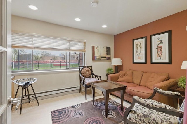 living area with recessed lighting and wood finished floors