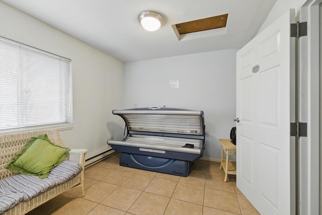 miscellaneous room with light tile patterned flooring, baseboards, and baseboard heating