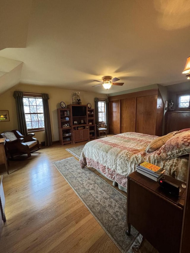 3216 Moorland Ave, Racine, WI 53405 - bedroom with light wood-style floors, a ceiling fan, and vaulted ceiling
